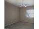 Bedroom with neutral walls, ceiling fan, carpet flooring, and window with blinds at 8068 W Carlota Ln, Peoria, AZ 85383