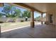 A spacious covered patio overlooks the well-kept backyard at 8068 W Carlota Ln, Peoria, AZ 85383