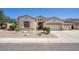 Charming single-story home featuring stucco siding, a tile roof, and a well-manicured front yard with desert landscaping at 8068 W Carlota Ln, Peoria, AZ 85383
