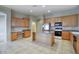 Spacious kitchen with a center island, ample counter space, and modern appliances, ideal for cooking and gatherings at 8068 W Carlota Ln, Peoria, AZ 85383
