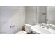 Powder room featuring a pedestal sink, toilet, and mirror at 8068 W Carlota Ln, Peoria, AZ 85383