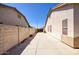 A long side yard featuring a large paved area and block wall at 8068 W Carlota Ln, Peoria, AZ 85383