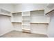 Walk-in closet with built-in shelving and rods for optimal organization and storage at 8068 W Carlota Ln, Peoria, AZ 85383