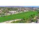An aerial view displays the property's proximity to Scottsdale, the golf course, and neighborhood amenities at 8541 E Krail St, Scottsdale, AZ 85250