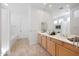 Bright bathroom features double sinks, a large mirror, and a separate room for the toilet and tub at 8541 E Krail St, Scottsdale, AZ 85250