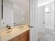 Bathroom with vanity and mirror, adjacent to rooms featuring a toilet and a bath at 8541 E Krail St, Scottsdale, AZ 85250