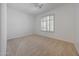 Bright, neutral bedroom with shuttered window and ceiling fan at 8541 E Krail St, Scottsdale, AZ 85250