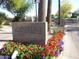 The Village at Scottsdale Links entrance with flowers and a gray stone sign at 8541 E Krail St, Scottsdale, AZ 85250