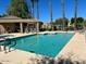 Beautiful community pool area featuring sparkling pool, spa, and lounge chairs at 8541 E Krail St, Scottsdale, AZ 85250