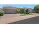 Charming single-story home features manicured landscaping, three-car garage and paver driveway at 8541 E Krail St, Scottsdale, AZ 85250