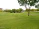 Relaxing greens of the golf course provide a serene backdrop to nearby homes in this community at 8541 E Krail St, Scottsdale, AZ 85250