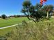 Picturesque golf course with winding path, lush vegetation and mountain backdrop at 8541 E Krail St, Scottsdale, AZ 85250