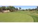 Scenic view of the golf course features a well-manicured green and mature trees enhancing the course at 8541 E Krail St, Scottsdale, AZ 85250
