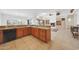 Bright kitchen with granite countertops, backsplash, stainless steel appliances, open to living area at 8541 E Krail St, Scottsdale, AZ 85250