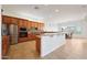 Open-concept kitchen with stainless steel appliances, granite countertops, and a breakfast bar overlooking a dining area at 8541 E Krail St, Scottsdale, AZ 85250