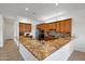 Spacious kitchen with granite counters, stainless appliances, mosaic backsplash, and light wood cabinets at 8541 E Krail St, Scottsdale, AZ 85250