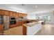 Large kitchen with breakfast bar, stainless steel appliances, granite countertops, and casual dining area at 8541 E Krail St, Scottsdale, AZ 85250