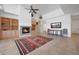 Bright living room featuring a fireplace, built-in cabinets, and an area rug at 8541 E Krail St, Scottsdale, AZ 85250