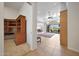 Open-concept living room with built-in shelving and access to the backyard patio at 8541 E Krail St, Scottsdale, AZ 85250