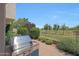 Outdoor kitchen area featuring a built-in grill and views of the lush green golf course at 8541 E Krail St, Scottsdale, AZ 85250