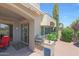 Charming outdoor patio with grill, beautiful landscaping, and access to living area at 8541 E Krail St, Scottsdale, AZ 85250