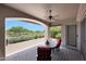 Covered patio area with chairs and beautiful views of the golf course at 8541 E Krail St, Scottsdale, AZ 85250