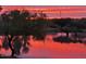 Scenic pond reflecting sunset sky with trees. Very serene view at 8541 E Krail St, Scottsdale, AZ 85250