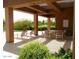 Inviting poolside lounge area with comfortable seating, shaded pergola, and desert landscaping at 8541 E Krail St, Scottsdale, AZ 85250