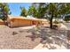 Single-story home with a desert landscape, mature tree, and a two-car garage at 9645 W Kimberly Way, Peoria, AZ 85382