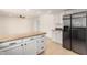 Bright kitchen island and white cabinetry with modern stainless steel appliances at 9645 W Kimberly Way, Peoria, AZ 85382