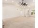 Expansive living room with neutral tones, vaulted ceilings, and ample space for entertaining at 9645 W Kimberly Way, Peoria, AZ 85382