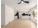 Bright living room with an open-concept kitchen and neutral color palette at 9645 W Kimberly Way, Peoria, AZ 85382
