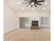 Large living room with ample natural light, fireplace, and a large fan on a vaulted ceiling at 9645 W Kimberly Way, Peoria, AZ 85382