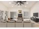 Spacious living room with a fireplace, neutral tones, and ample natural light at 9645 W Kimberly Way, Peoria, AZ 85382