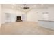 Open living room with a neutral color scheme, high ceilings, fireplace, and fan at 9645 W Kimberly Way, Peoria, AZ 85382