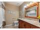 Bathroom with decorative mirror and framed art at 9666 W Mountain View Rd # A, Peoria, AZ 85345