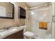 Neutral bathroom featuring a granite countertop and a glass-enclosed shower at 9666 W Mountain View Rd # A, Peoria, AZ 85345