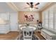 Charming dining area with a round table, white chairs, and natural light from the windows at 9666 W Mountain View Rd # A, Peoria, AZ 85345