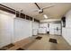Spacious garage featuring laundry area with washer, dryer, and ample storage cabinets at 9666 W Mountain View Rd # A, Peoria, AZ 85345