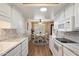 Well-lit kitchen and dining area featuring modern appliances and white cabinetry at 9666 W Mountain View Rd # A, Peoria, AZ 85345