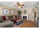 Cozy living room featuring a decorative fireplace, ample seating and neutral wall color at 9666 W Mountain View Rd # A, Peoria, AZ 85345