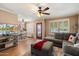 Comfortable living room showcasing hardwood floors, large windows, and neutral wall color at 9666 W Mountain View Rd # A, Peoria, AZ 85345