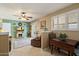 Inviting living room with a fireplace, ceiling fan, and sliding doors at 9666 W Mountain View Rd # A, Peoria, AZ 85345