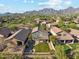 Residential neighborhood with mountain views, desert landscaping, and backyard oasis at 10252 E Butherus Dr, Scottsdale, AZ 85255