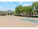 Recreational area featuring a basketball court and a playground with mountain views at 10252 E Butherus Dr, Scottsdale, AZ 85255