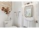 Stylish half bathroom featuring a pedestal sink and decorative elements at 10252 E Butherus Dr, Scottsdale, AZ 85255