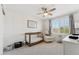 Cozy Bedroom with neutral tones, a crib, and a view of the desert landscape at 10252 E Butherus Dr, Scottsdale, AZ 85255