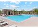 Inviting community pool area with comfortable lounge chairs and shaded seating, perfect for relaxation at 10252 E Butherus Dr, Scottsdale, AZ 85255