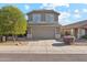 Charming two-story home with a well-manicured lawn and a two-car garage at 10252 E Butherus Dr, Scottsdale, AZ 85255