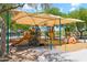 Community playground under a sunshade with climbing and sliding structures at 10252 E Butherus Dr, Scottsdale, AZ 85255
